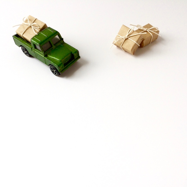 Miniature toy truck moving gifts